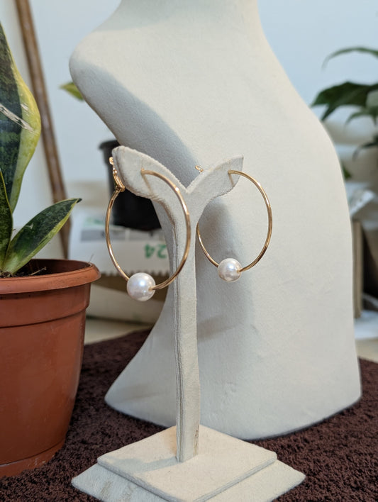 A Gold Hoop & A White Stud