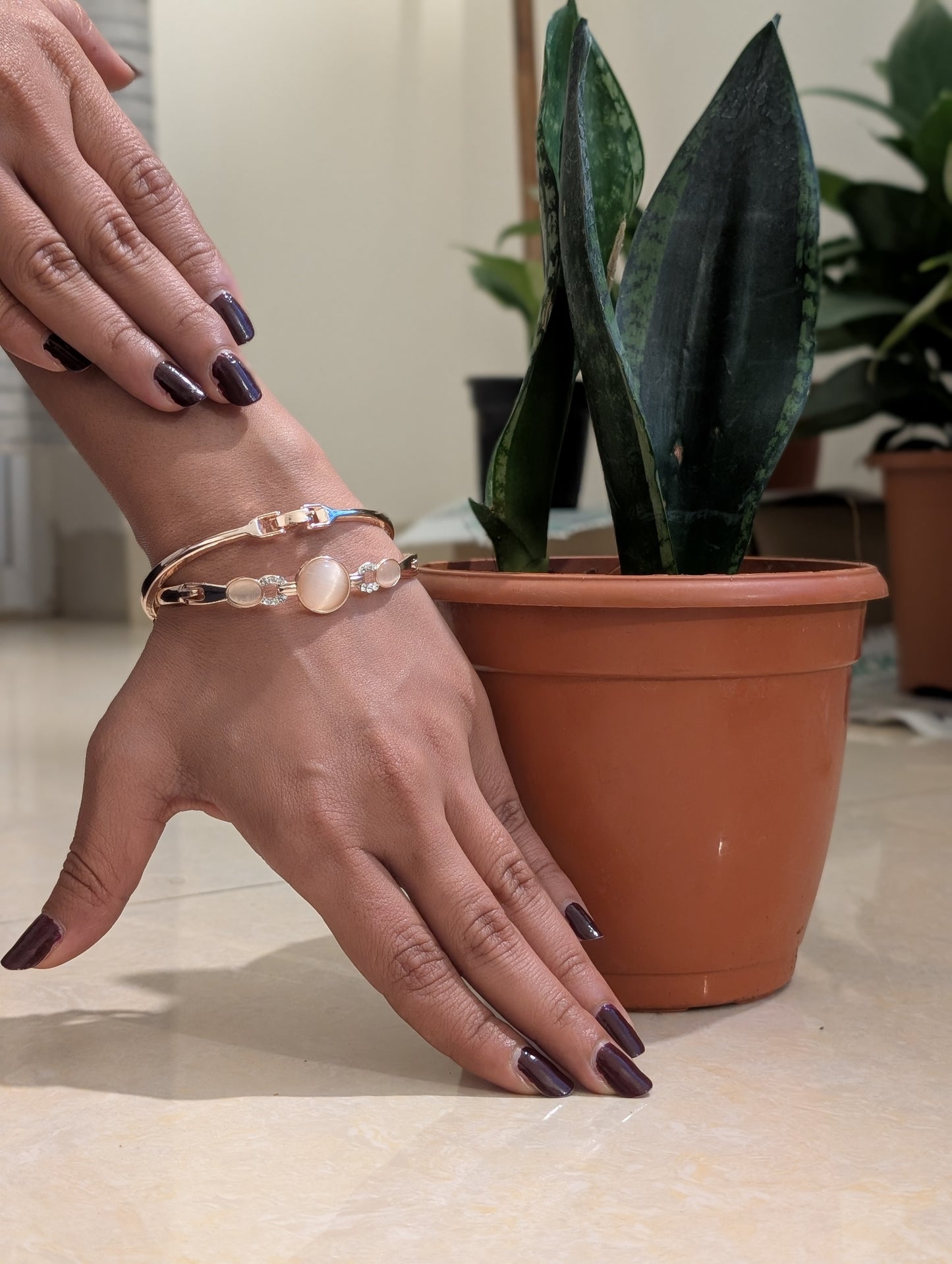 A Pink stud in the golden Bracelet