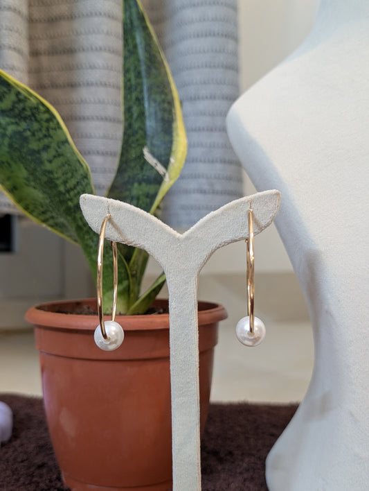 A Gold Hoop & A White Stud
